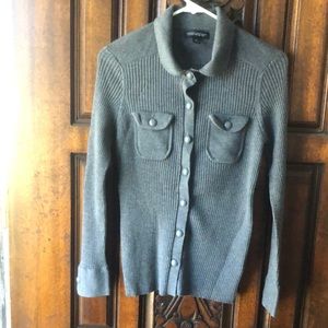 Grey cardigan sweater with collar and button sleeves.